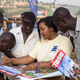Ronah Ahumuza provides information on human rights, election day procedures and avoiding violence to young voters in Katongole slum.
